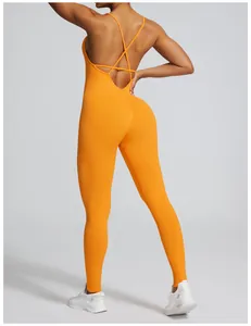 Back view of seamless orange yoga bodysuit with cross-back straps for fitness.