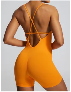 Detailed back view of a vibrant orange seamless cross-back yoga bodysuit for fitness
