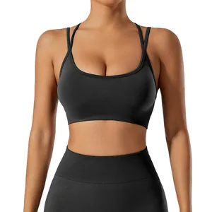 Professional women's black cross-back sports bra and high-waist yoga leggings set for gym