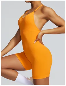 Side view detail of orange seamless backless yoga jumpsuit with ribbed texture