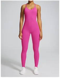 Full view of a vibrant pink seamless one-piece yoga jumpsuit for women's fitness.
