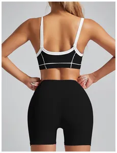 Detailed back view of high-impact sports bra featuring white trim and matching black gym shorts