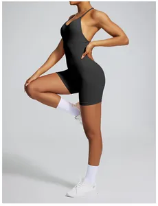 Professional side view of a seamless backless black yoga jumpsuit featuring a slim fit design
