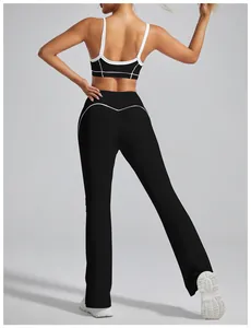 Detailed back view of black flared yoga pants with white piping for a butt lifting effect