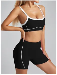 High-impact black sports bra with contrast white trim for gym workout yoga training