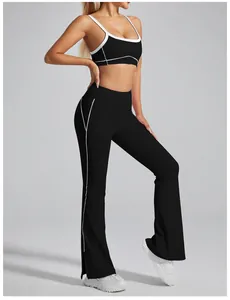 Premium black high-waisted flared yoga pants with white piping and leg slit details