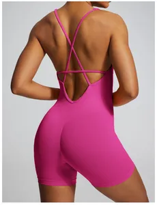 Close-up of the cross-strap backless design on a pink seamless ribbed yoga bodysuit