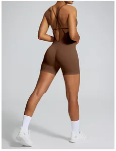 Back view of a seamless brown yoga romper featuring an open back and crisscross straps.