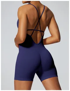 Detailed back view of a navy blue ribbed seamless athletic bodysuit with cross straps.