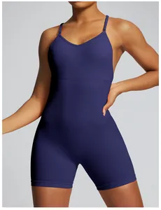 Detailed view of a seamless navy blue one-piece yoga bodysuit with thin spaghetti straps