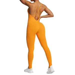 Back view of a vibrant orange seamless yoga jumpsuit featuring elegant crisscross straps