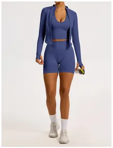 Professional studio shot of a woman wearing a blue three-piece seamless yoga set outfit