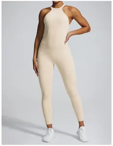 Professional macro shot of a beige quick-drying backless fitness bodysuit worn by a model