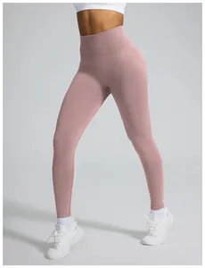 Detail view of seamless high-waisted pink yoga leggings for gym fitness and workout