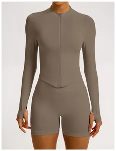 Detail of seamless yoga set with ribbed texture and long-sleeve zip-up top