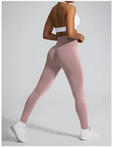 Rear view of seamless pink high-waisted yoga pants with scrunch butt detail