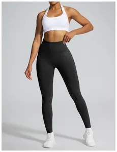 High-waisted black seamless yoga leggings with peach butt lifting effect for fitness