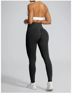 High-waisted seamless black scrunch butt yoga leggings showing lifting effect from the back