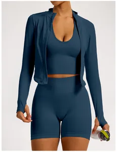 Close-up detail of three-piece seamless navy blue yoga set with ribbed waistband