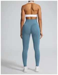 Back view of high-waisted seamless scrunch butt yoga leggings in dusty blue color