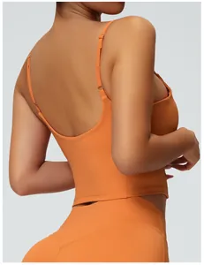 Back view detail of an orange yoga tank top with thin straps and a slim fit
