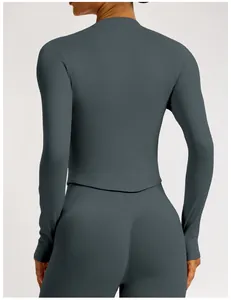 Detailed back view of a seamless ribbed dark grey yoga set with waist-slimming design