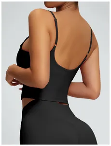 Close-up view of back detail on black strappy yoga tank top with padded support