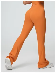 Detailed back view of high-waisted orange flare yoga pants with hip-lifting design