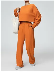 Orange cropped long-sleeved sweatshirt and wide-leg sweatpants lounge set for women