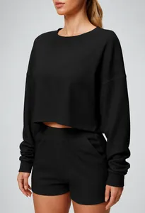 Close-up of black long-sleeved cropped sweatshirt and matching sports shorts set