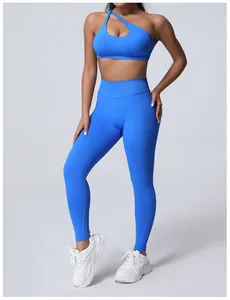 Bright blue seamless high-waisted yoga set with one-shoulder sports bra and leggings