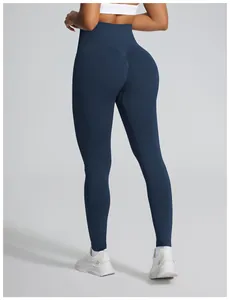 Rear view detail of professional high-waist seamless scrunch butt yoga leggings in navy blue