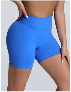 Close-up detail of blue seamless high-waisted yoga shorts showing tummy control fit