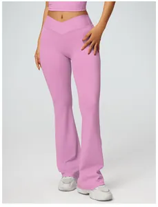 Detail view of high waist yoga flare pants with V-shaped waistband in soft pink color