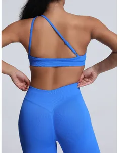 Detailed back view of a blue seamless sports bra featuring an asymmetrical strap design