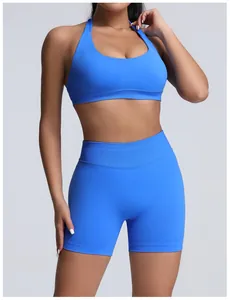 Close-up of seamless matte high waist blue yoga shorts and matching sports bra set.