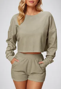 Detail of khaki cropped long-sleeve sweatshirt showing premium ribbed fabric texture