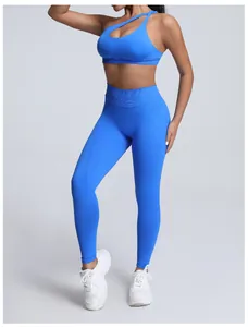 Detailed view of women's one-shoulder seamless blue yoga sports bra and leggings set.