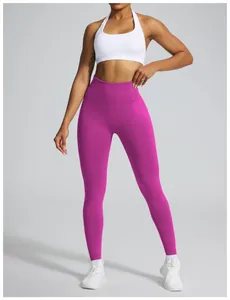 Detail shot of high-waisted magenta seamless yoga leggings with peach butt lifting effect