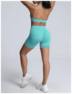 Back view of seamless turquoise high-waisted yoga shorts with push-up fit for women