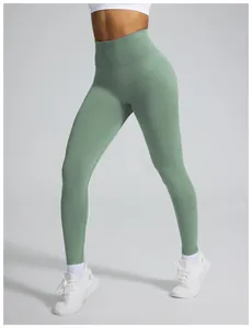 High-waisted seamless sage green yoga leggings with peach butt-lifting design