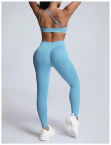 Back view of light blue seamless yoga set with asymmetrical sports bra and leggings