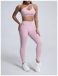 Detailed shot of seamless high-waist matte yoga leggings and sports bra in light pink.