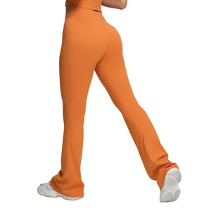 High waisted orange flared yoga pants featuring butt lifting design for fitness workout
