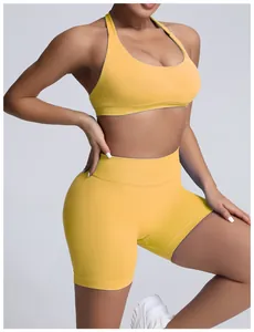 Detail view of yellow seamless high-waisted yoga shorts with tummy control compression