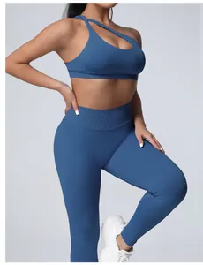 Detailed view of a blue one-shoulder seamless sports bra and high-waist yoga leggings