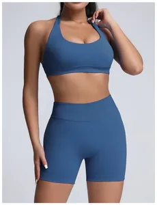 Detailed view of women's blue high-waisted seamless sports bra and yoga shorts workout set