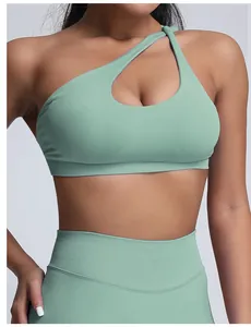Macro detail of sage green seamless one-shoulder yoga sports bra with cutout design