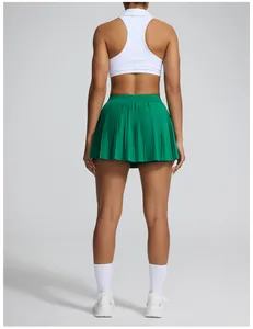 Vue arrière d'une jupe de tennis plissée verte à taille haute pour le fitness féminin