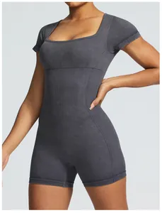 Close-up detail of gray seamless rib-knit short sleeve workout yoga bodysuit for women